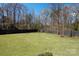 Spacious fenced-in backyard with green lawn at 2924 Springs Dr, Charlotte, NC 28226