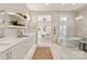 Bathroom features soaking tub and shower, floating shelves, and a spacious layout at 2924 Springs Dr, Charlotte, NC 28226