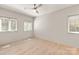 Well-lit bedroom with hardwood floors and windows offering natural light, and neutral wall color at 2924 Springs Dr, Charlotte, NC 28226