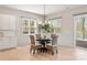 Bright dining area featuring natural light, modern chandelier, and sliding door access at 2924 Springs Dr, Charlotte, NC 28226