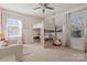 Charming bedroom features a loft bed with storage beneath, pink accents and ample natural light at 3203 Thayer Dr, Waxhaw, NC 28173