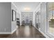 Elegant foyer featuring hardwood floors, a chandelier, and stylish decor with a view into other rooms at 3203 Thayer Dr, Waxhaw, NC 28173