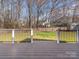 View from the deck showing a spacious fenced backyard, perfect for outdoor activities and relaxation at 3274 Roberta Farms Sw Ct, Concord, NC 28027