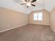 Bedroom featuring a ceiling fan, neutral walls, carpet flooring, and natural light from the window at 3274 Roberta Farms Sw Ct, Concord, NC 28027