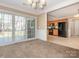 Inviting dining area with sliding glass doors to the deck, adjacent to a well-equipped kitchen at 3274 Roberta Farms Sw Ct, Concord, NC 28027