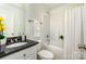 Well-maintained bathroom with a shower-tub combo, vanity with granite countertop, and modern fixtures at 329 Gurley Nw Dr, Concord, NC 28027