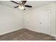 Spacious bedroom with plush carpeting, ceiling fan and bright white trim and doors at 329 Gurley Nw Dr, Concord, NC 28027