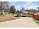 Charming one-story home with light gray siding, front porch, and long driveway at 329 Gurley Nw Dr, Concord, NC 28027