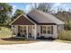 Charming single-story home with a covered porch and nicely landscaped front yard at 329 Gurley Nw Dr, Concord, NC 28027