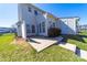 Exterior view of the back of the home showing a patio and white siding at 4221 Coulter Xing, Charlotte, NC 28213