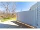 View of the back patio area showing a white fence under a blue sky at 4221 Coulter Xing, Charlotte, NC 28213