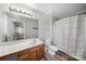 Bathroom with shower/tub combo, vanity, and a view into the bedroom at 4221 Coulter Xing, Charlotte, NC 28213