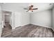 Spacious bedroom featuring ceiling fan, new flooring, and a walk-in closet at 4221 Coulter Xing, Charlotte, NC 28213