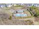 Aerial view of the community pool and recreational area surrounded by a green space at 4221 Coulter Xing, Charlotte, NC 28213