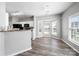 Bright dining area featuring modern lighting, a bay window, and wood-look floors at 4221 Coulter Xing, Charlotte, NC 28213