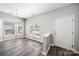 Bright living room with wood-look flooring, recessed lighting, and natural light at 4221 Coulter Xing, Charlotte, NC 28213