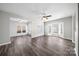 Bright and spacious living room featuring ample natural light and stylish wood flooring at 4221 Coulter Xing, Charlotte, NC 28213