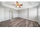 Main bedroom featuring a ceiling fan, neutral paint and vinyl flooring at 4221 Coulter Xing, Charlotte, NC 28213