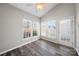 Bright sunroom featuring natural light, a ceiling fan and luxury vinyl plank flooring at 4221 Coulter Xing, Charlotte, NC 28213