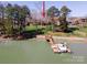 A stunning waterfront property offers a private dock, boat slip, and lake access at 4300 Pointe Norman Dr, Sherrills Ford, NC 28673