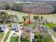 Beautiful aerial view showcases home, mature trees, and well-maintained landscaping at 4300 Pointe Norman Dr, Sherrills Ford, NC 28673