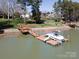 Aerial view of a home featuring a private dock, boat, and easy lake access at 4300 Pointe Norman Dr, Sherrills Ford, NC 28673