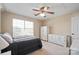 Inviting bedroom featuring neutral carpeting, a ceiling fan, and white wood furniture for storage at 4300 Pointe Norman Dr, Sherrills Ford, NC 28673