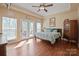 Spacious bedroom boasts tray ceilings, hardwood floors, with access to a private outdoor patio area at 4300 Pointe Norman Dr, Sherrills Ford, NC 28673