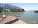 A private dock features a fun water slide, perfect for enjoying lake activities at 4300 Pointe Norman Dr, Sherrills Ford, NC 28673