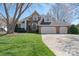 Charming brick home features a well-manicured lawn and attached two car garage at 4300 Pointe Norman Dr, Sherrills Ford, NC 28673