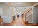 Inviting foyer with hardwood floors leading into a spacious living room with fireplace at 4300 Pointe Norman Dr, Sherrills Ford, NC 28673