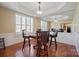 Spacious game room featuring a poker table, bar stools, and large windows with shutters at 4300 Pointe Norman Dr, Sherrills Ford, NC 28673