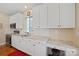 Well-lit kitchen featuring granite countertops, white cabinetry, and stainless steel appliances at 4300 Pointe Norman Dr, Sherrills Ford, NC 28673