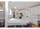 Bright kitchen with granite countertops, white cabinets, and seating at the breakfast bar at 4300 Pointe Norman Dr, Sherrills Ford, NC 28673