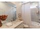 Elegant bathroom with a marble countertop, framed mirror, and a tub with a shower at 4412 Holly Ne Cir, Conover, NC 28613