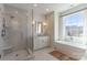 Stylish bathroom with a glass-enclosed shower, soaking tub, marble tiling, and white vanity at 4412 Holly Ne Cir, Conover, NC 28613