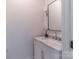 Elegant bathroom featuring a marble countertop, a modern mirror, and a stylish light fixture at 4412 Holly Ne Cir, Conover, NC 28613