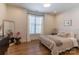 Cozy bedroom featuring a comfortable bed, a stylish mirror, and a window with natural light at 4412 Holly Ne Cir, Conover, NC 28613