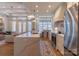 Bright, open kitchen with quartz countertops and stainless steel appliances flowing into the living room at 4412 Holly Ne Cir, Conover, NC 28613