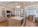 Modern kitchen and living area with large island for entertaining with stainless steel appliances at 4412 Holly Ne Cir, Conover, NC 28613