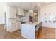 Bright kitchen with marble countertops, large eat-in island, and stainless steel appliances at 4412 Holly Ne Cir, Conover, NC 28613