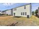 Exterior home backyard with sliding glass doors, patio, and landscaping at 4513 Staffordshire Ln, Charlotte, NC 28213