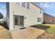 Exterior home backyard with sliding glass doors, patio, and landscaping at 4513 Staffordshire Ln, Charlotte, NC 28213