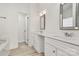 This bathroom features double sinks and a framed mirror at 4513 Staffordshire Ln, Charlotte, NC 28213