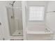 This bathroom features a shower and a soaking tub at 4513 Staffordshire Ln, Charlotte, NC 28213