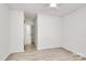 Bedroom featuring durable flooring and a closet with a mirrored door at 4513 Staffordshire Ln, Charlotte, NC 28213