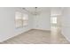 A bright dining room with light wood flooring, neutral walls, a large window and a chandelier at 4513 Staffordshire Ln, Charlotte, NC 28213