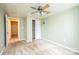 Spacious bedroom with light green walls, and open doorway to another room at 4846 Midway Sand Rd, Hickory, NC 28601