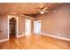 Bedroom with hardwood floors, a walk-in closet, ceiling fan, and bathroom entrance at 4846 Midway Sand Rd, Hickory, NC 28601