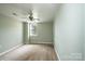 Bedroom with light green walls, neutral carpet, and window with natural light at 4846 Midway Sand Rd, Hickory, NC 28601